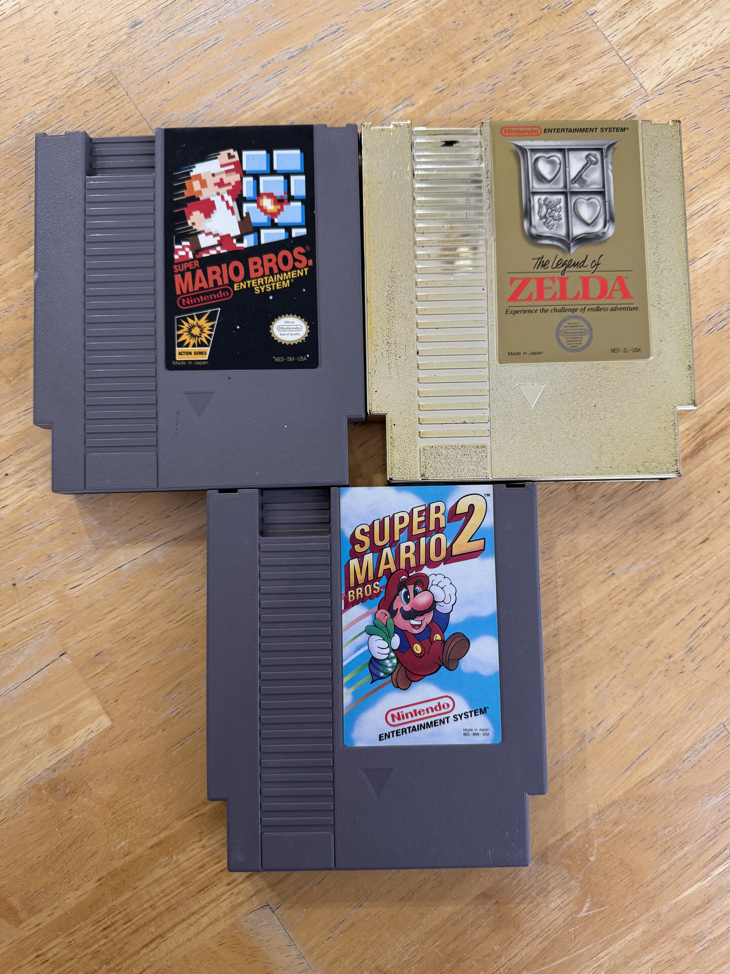 Original NES cartridges: Super Mario Bros., The Legend of Zelda and Super Mario Bros. 2